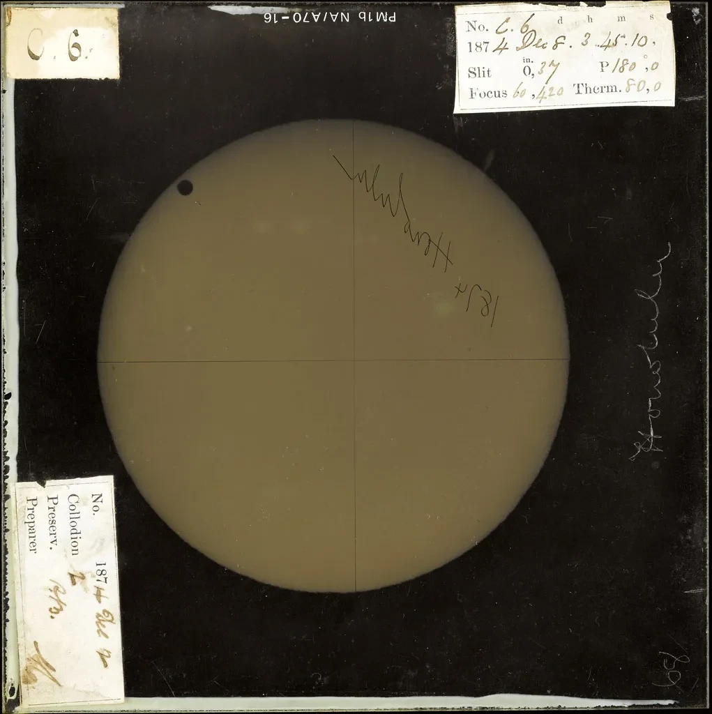 Negative image of Venus with handwritten notes stuck around the edges.