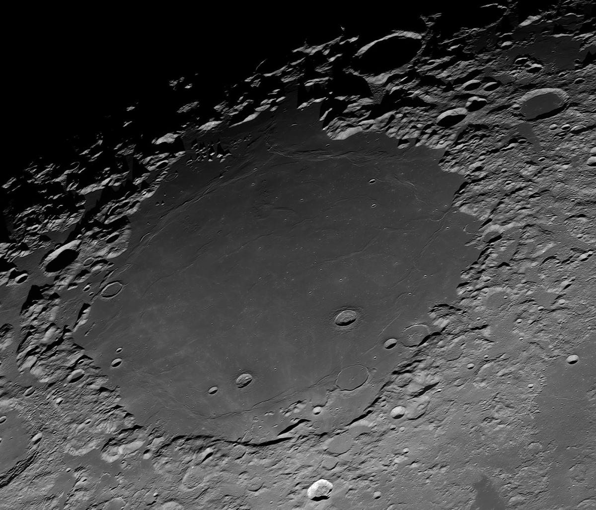 Shot of craters and a lunar sea on the surface of the Moon