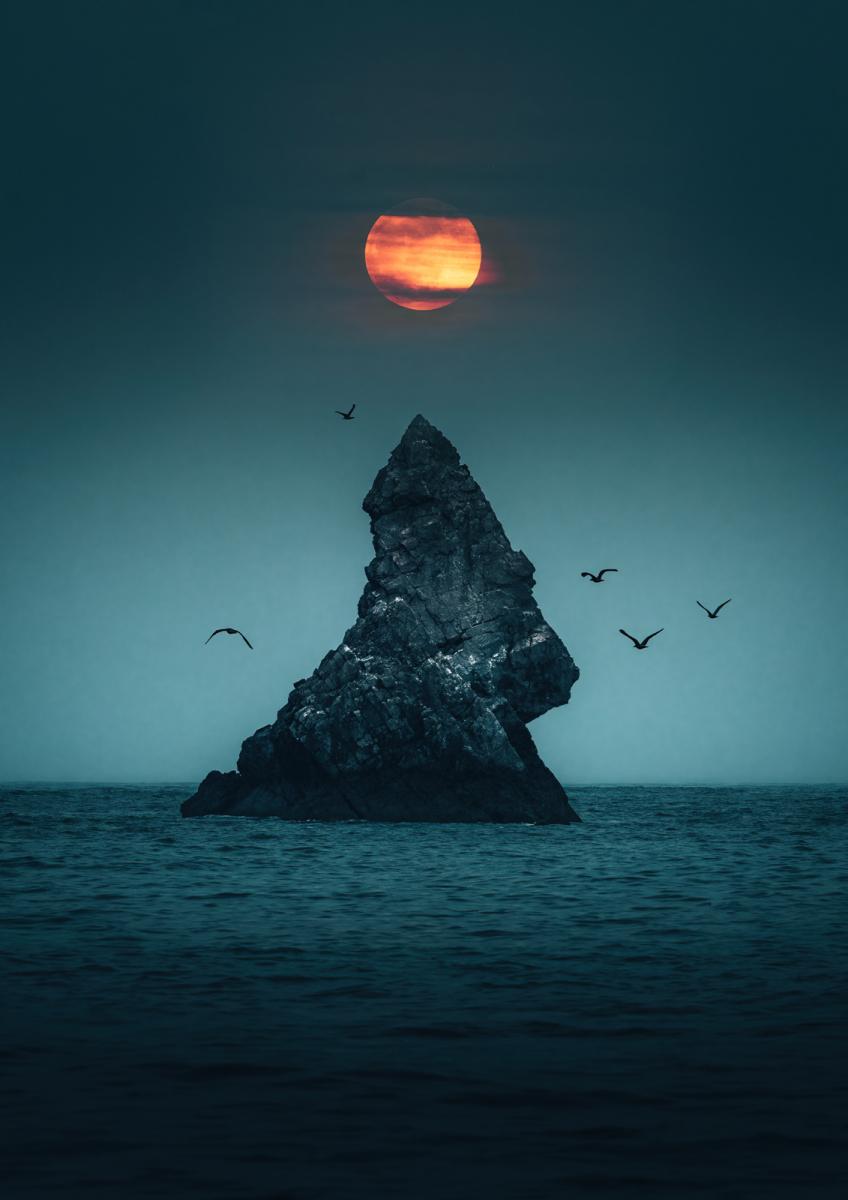 Full Moon rising over the sea and Church Rock in Broadhaven, Pembrokeshire 