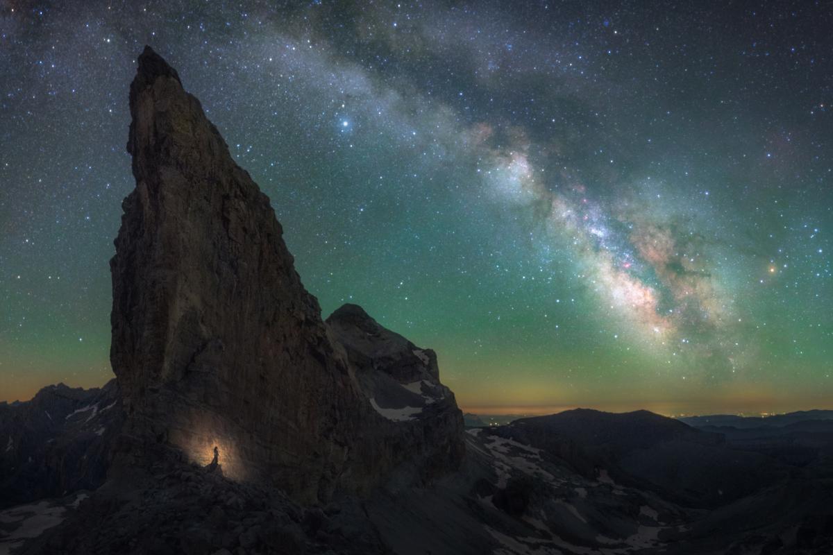 Panorama of the Milky Way over a high mountain ridge in the Pyrenees mountains