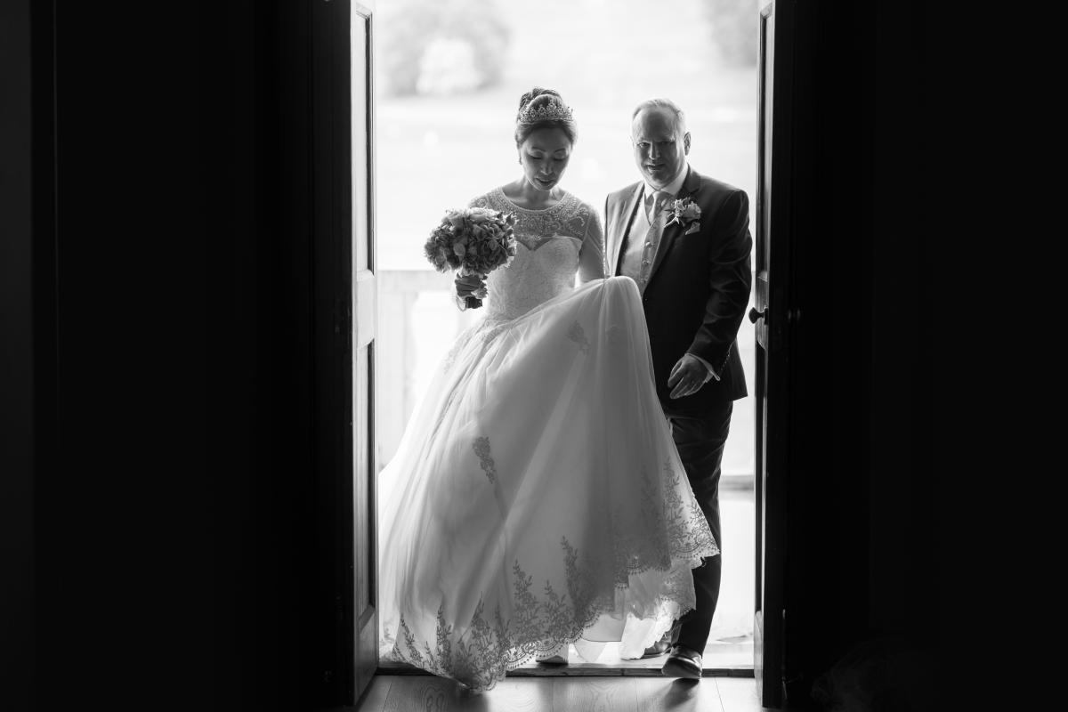 Couple coming through door of Loggia in black and white - credit to Jeff oliver photography