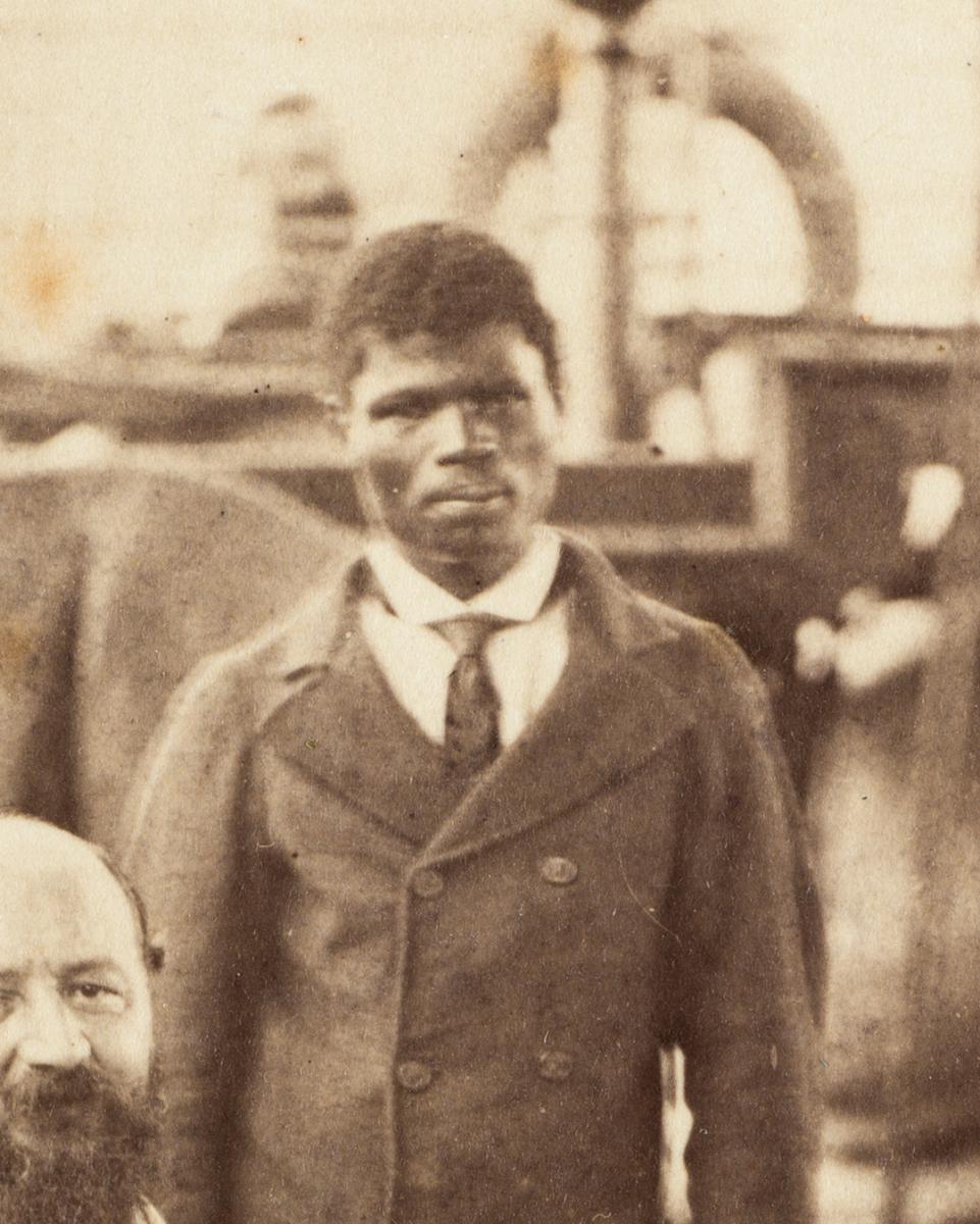 Historic photograph of a black man in double-breasted jacket and tie