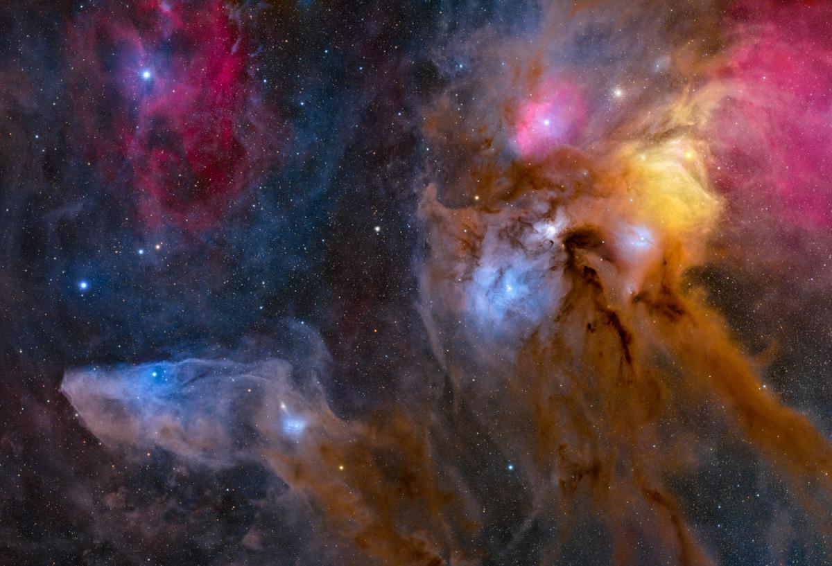 Gold, pink and blue dust formations around the star Antares