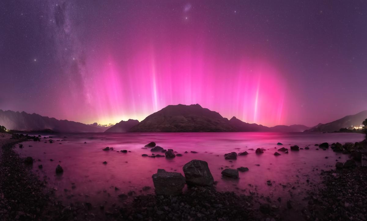 Pink Aurora Australis over mountains