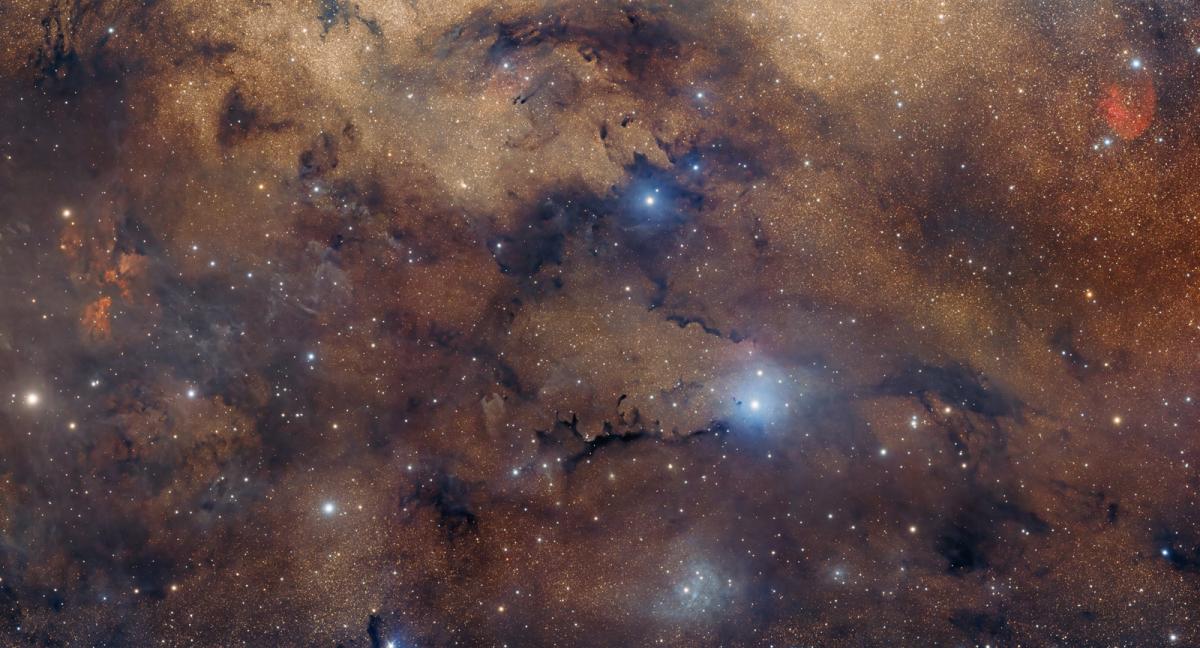 Serpens constellation against a golden backdrop of stars and clouds