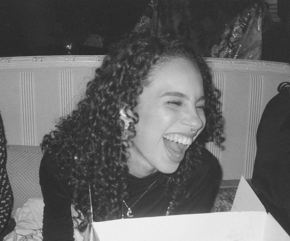 black and white photo of Skye Weston laughing