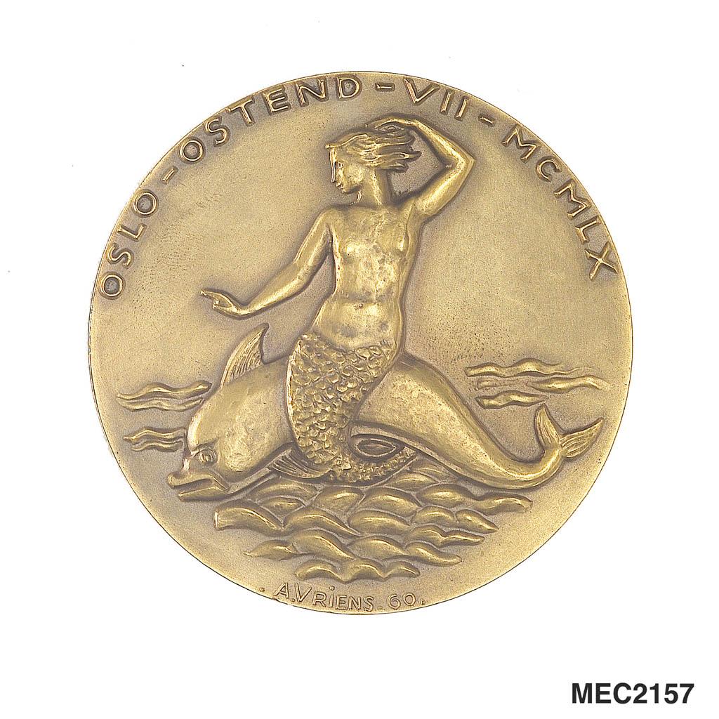 Medal commemorating the Oslo - Ostend Race, 1960. Obverse: A mermaid seated on a dolphin (left). Legend: 'OSLO - OSTEND . VII - MCMLX.' Reverse: Port-bow view of a barquentine under full sail. Legend: 'MERCATOR.'