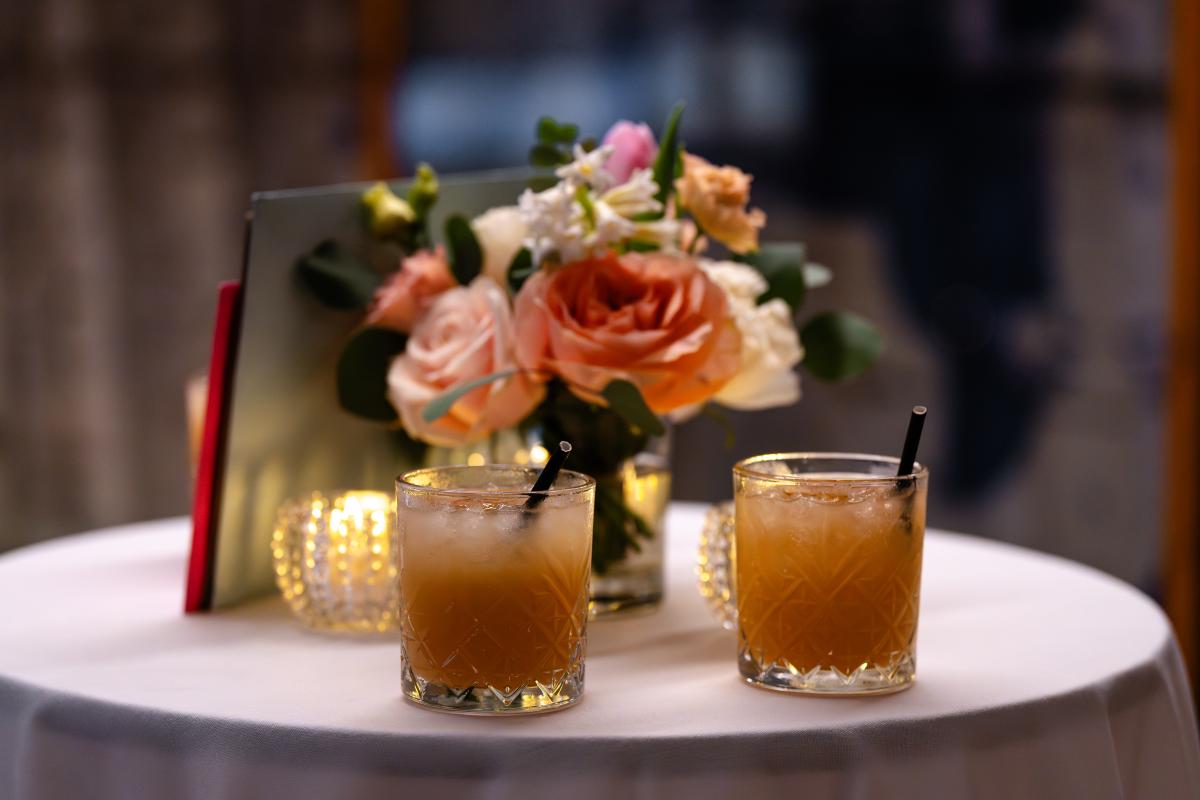 poseur table flowers and cocktails on a table in Tween Deck