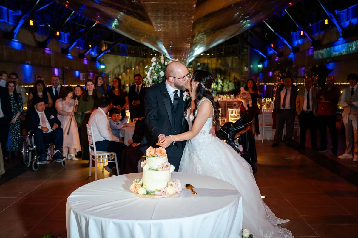 the couple cutting the cake 