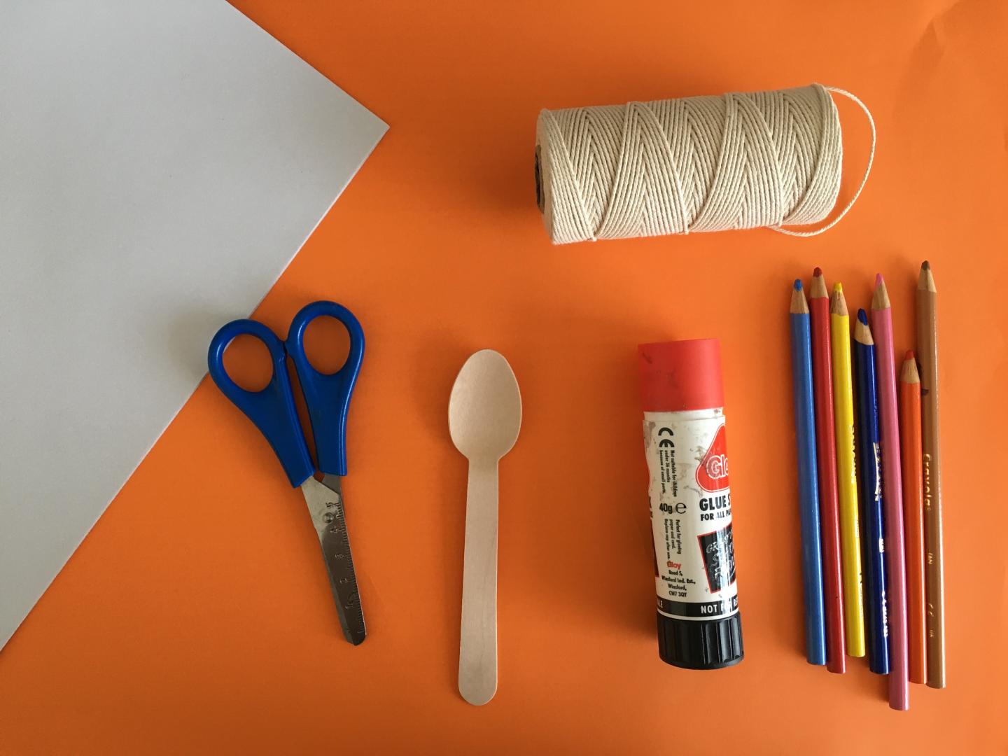 paper, scissors, wooden spoon, glue, coloured pencils, string
