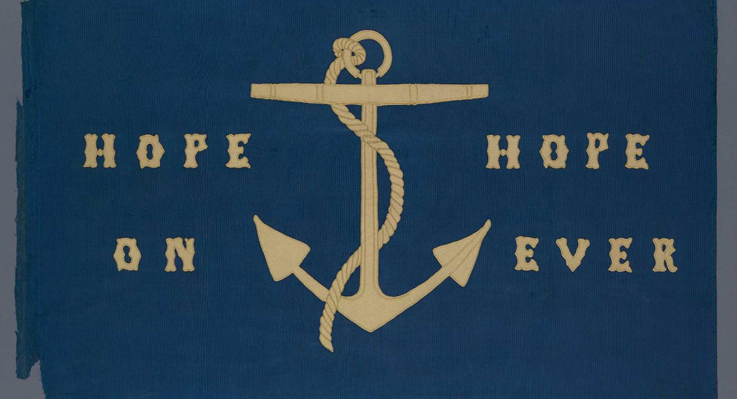 (Source of a blue flag with a gold inscription 'hope on hope ever' Image)