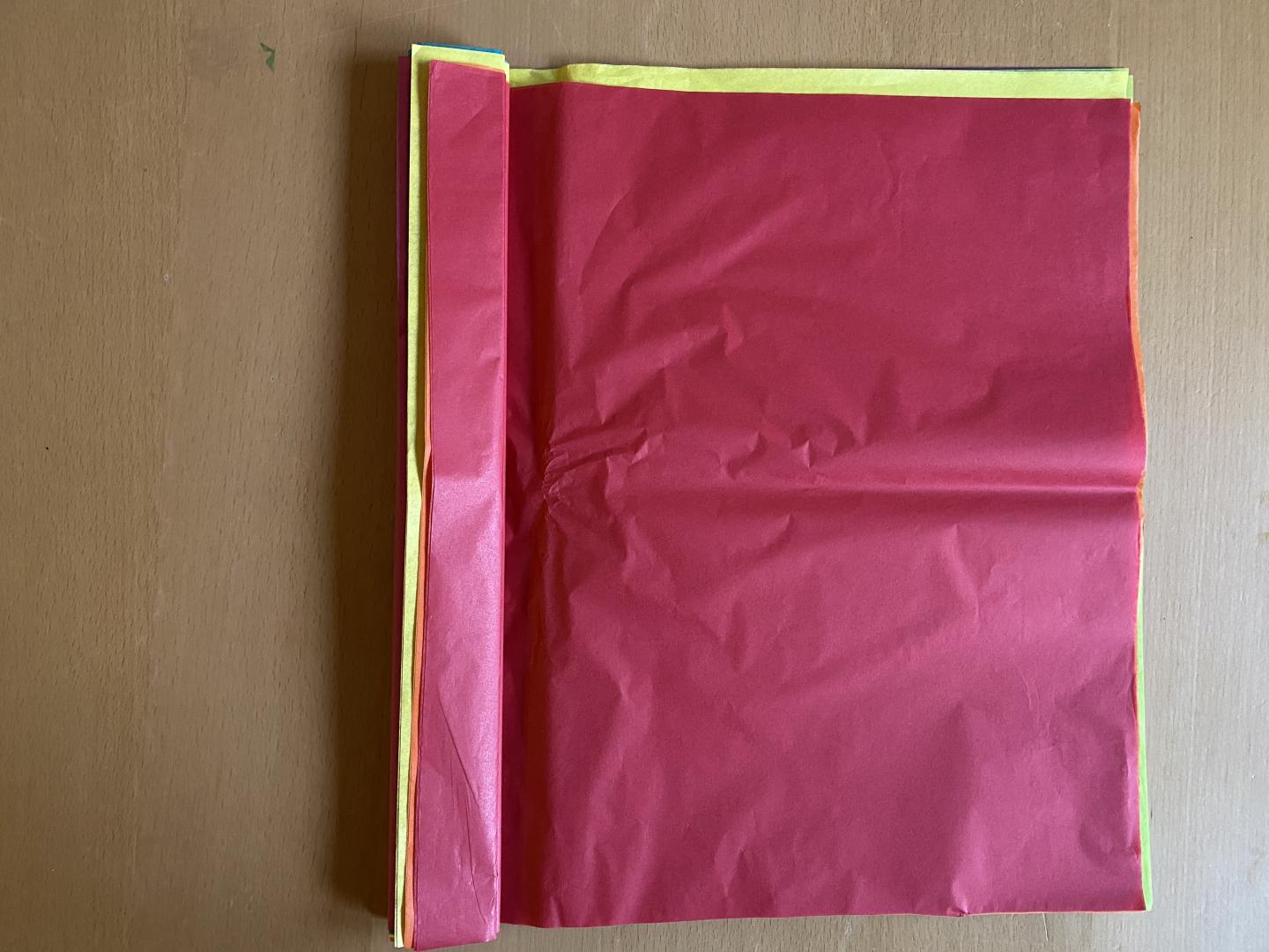 Red tissue paper folded over