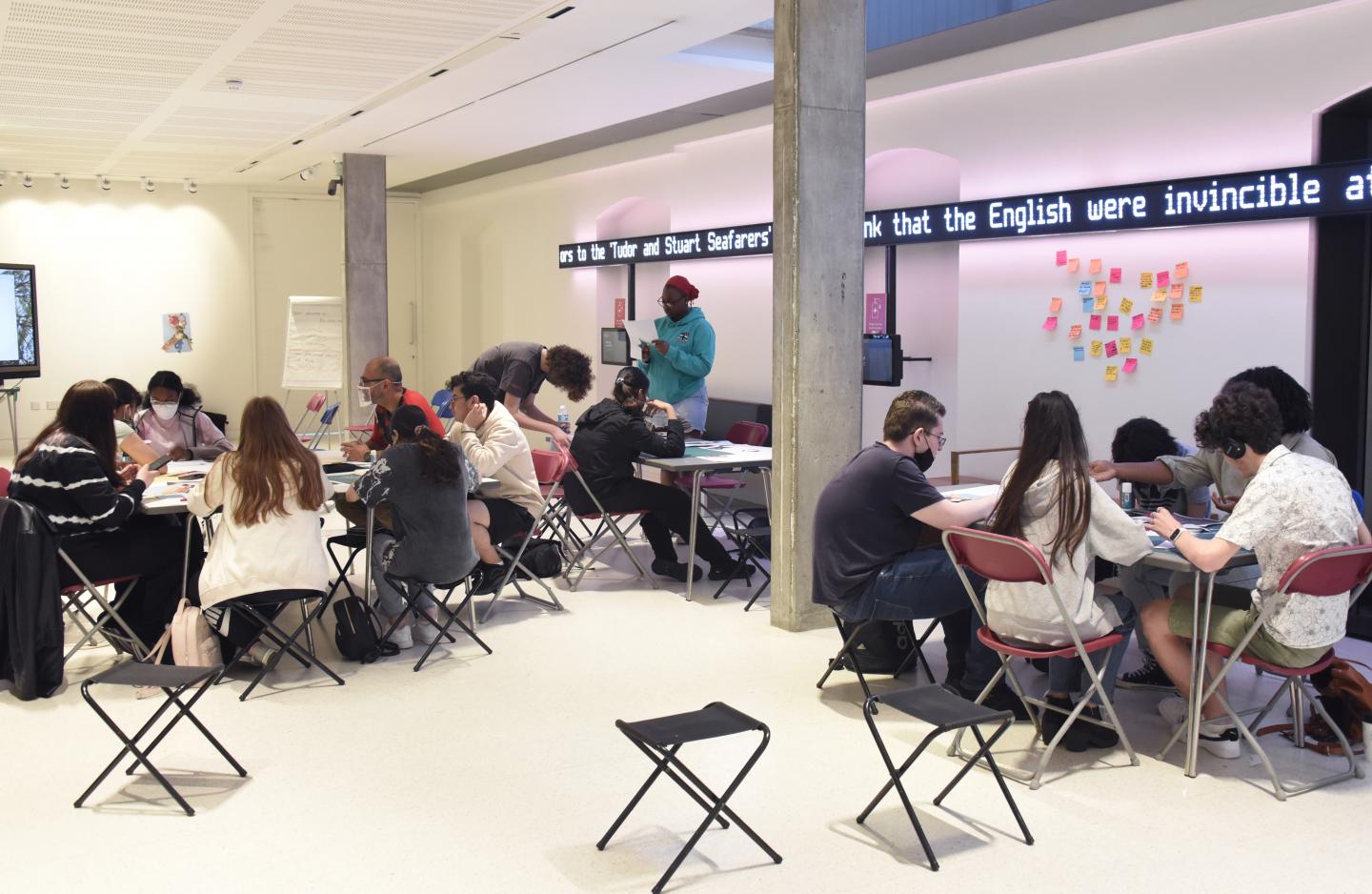 A group of young people in the Samy Ofer Wing lounge working on the Rethink Residency