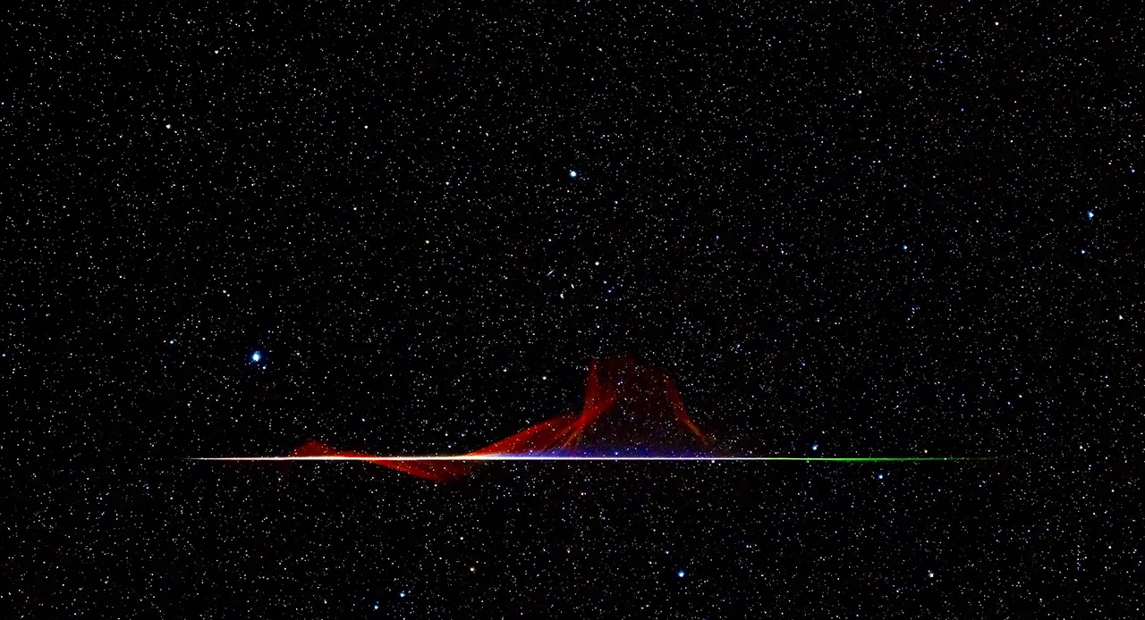 A dark photograph of the night sky with a horizontal flash of purple light from a meteor