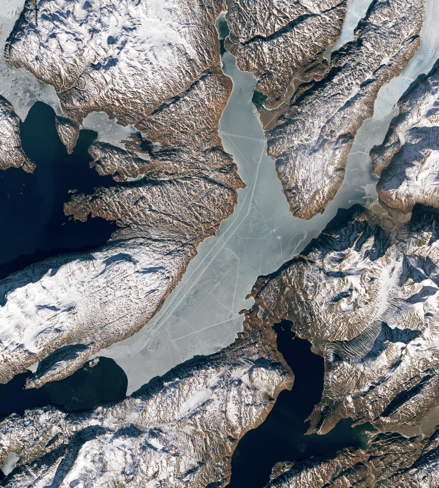 Satellite photograph of paths that cut across the Tunulliarfik Fjord in southern Greenland, likely made by people