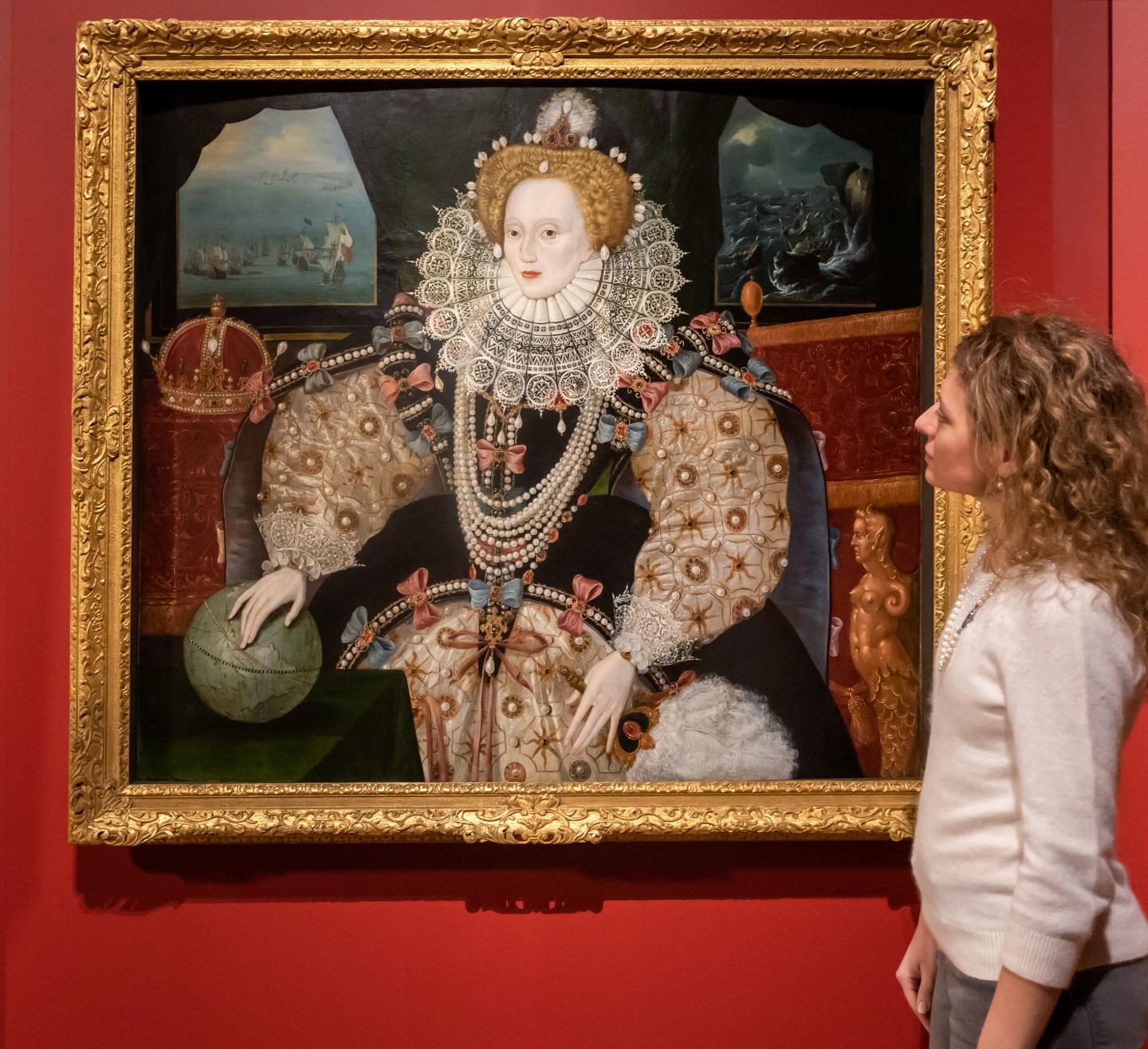 A woman looks at the painting of Elizabeth I known as the 'Armada Portrait', hanging in the Queen's House