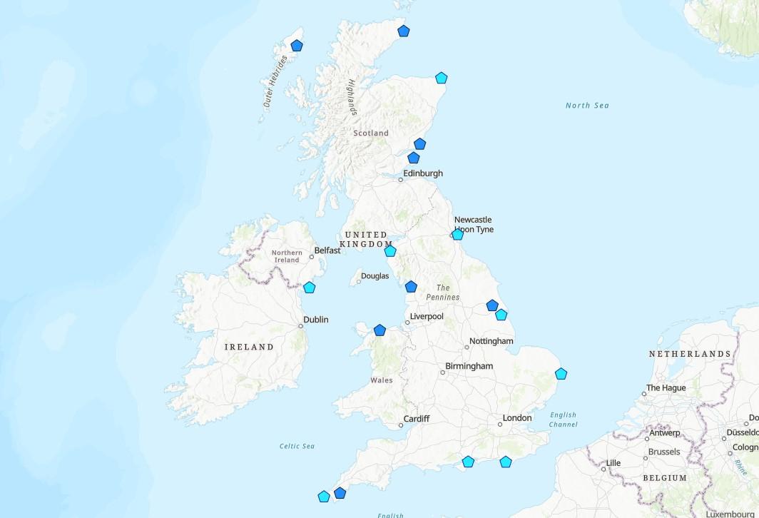 A screengrab of an interactive map of the United Kingdom showing light and dark blue hexagonal symbols marking sites of maritime memorials