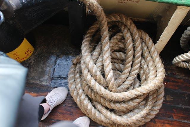 Image of hemp rope coiled on the floor of a boat