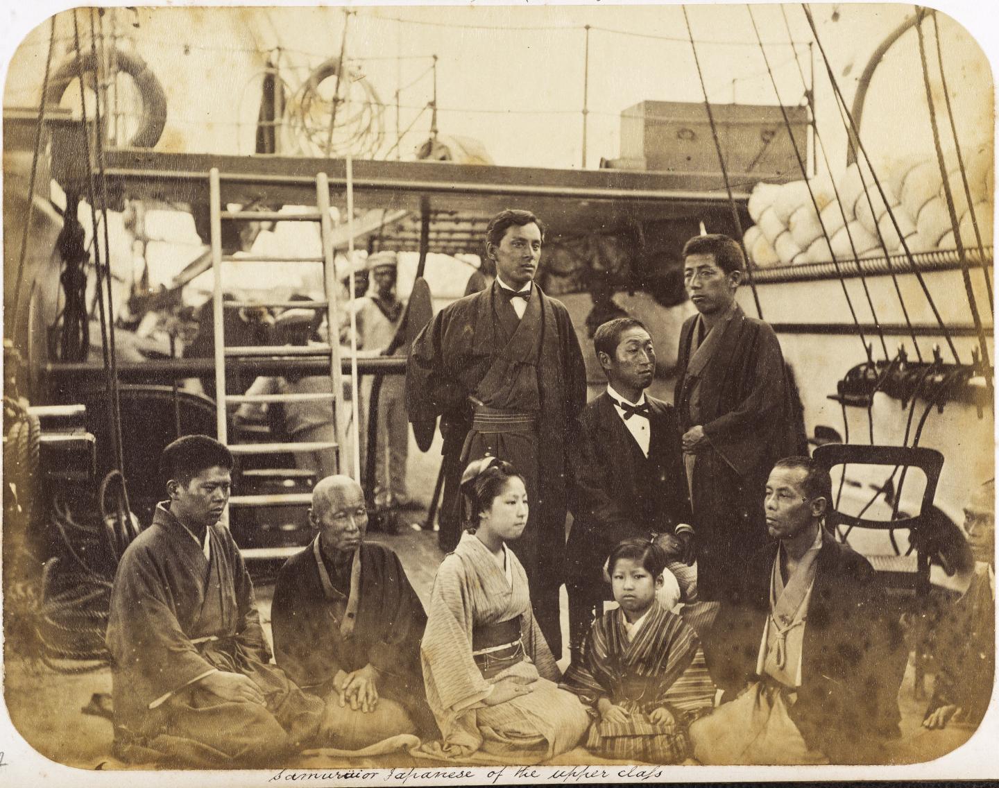 Historic photograph of a Japanese translator and possibly his family on board a ship