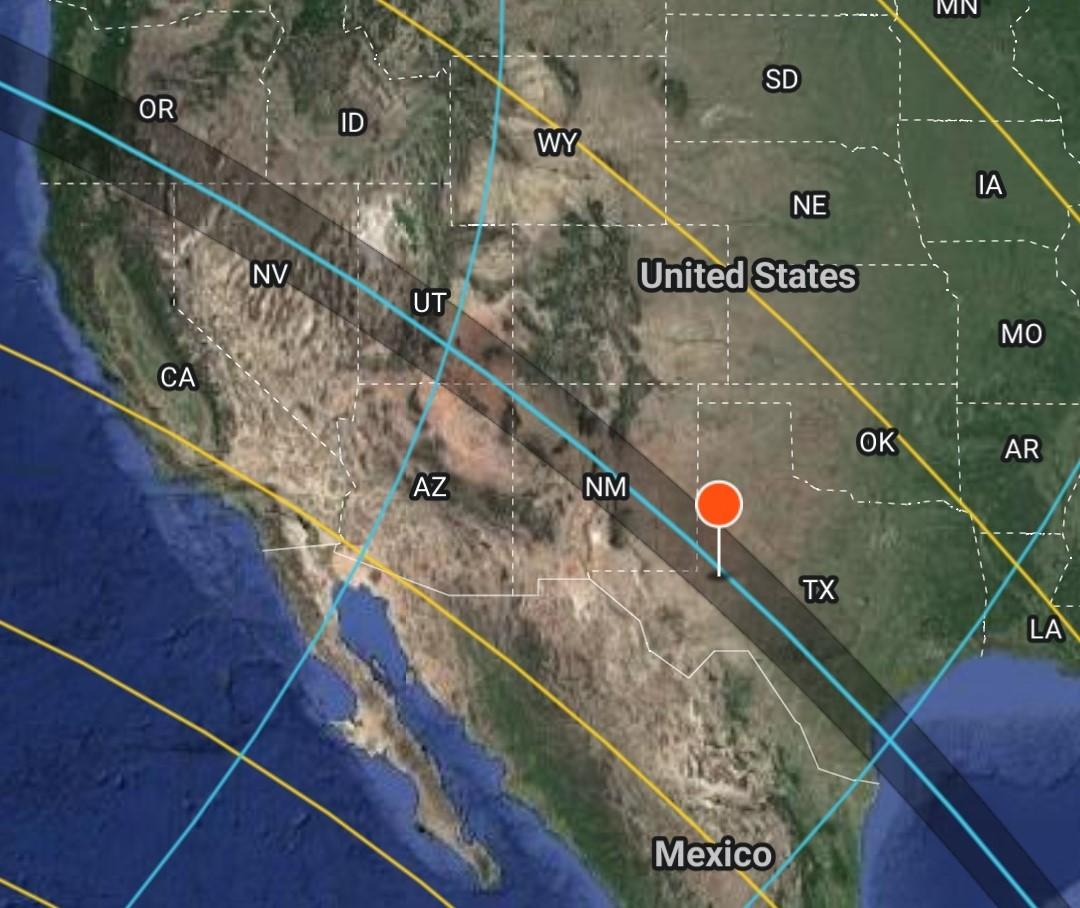 Satellite map of the south of the USA and Mexico with a curved shadowed line passing from the left to the right, with a red pin in a location in Texas