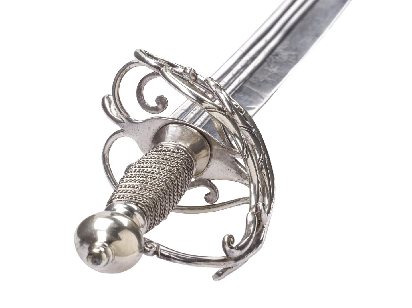 Close-up view of a silver-handled sword