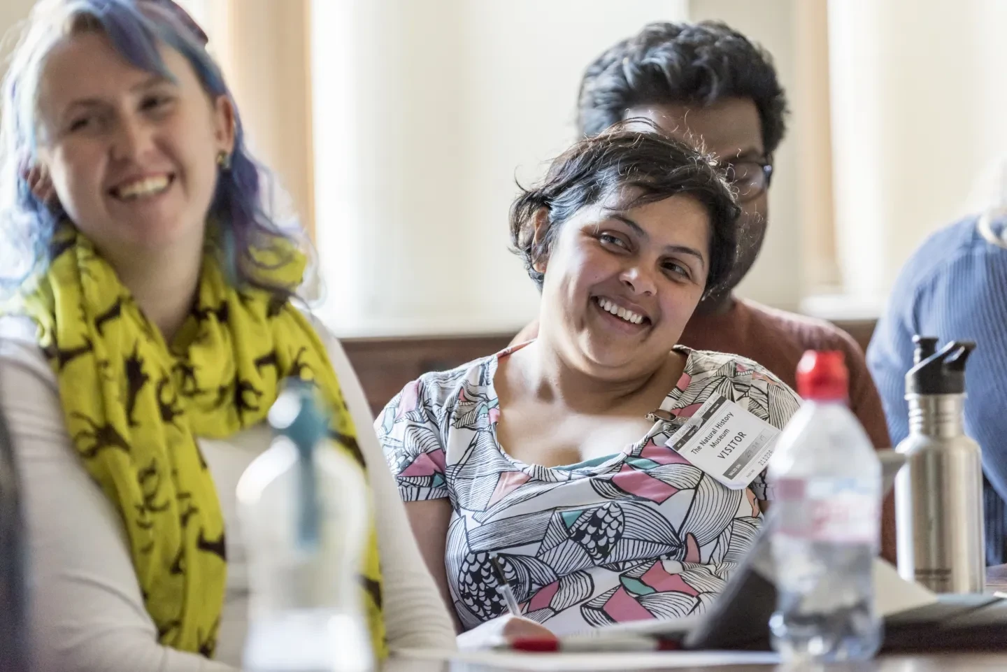 Smiling delegates at a Presenters Network event.